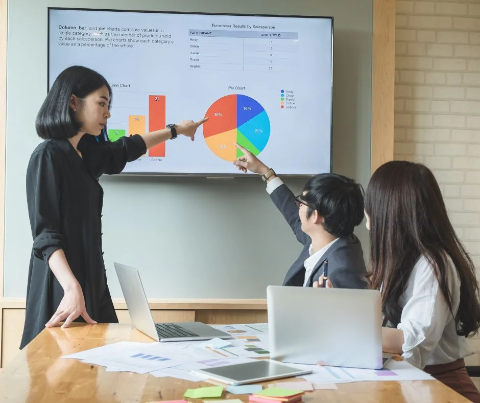 group-of-people-discussing-data-on-monitor-screen