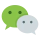 A green speech bubble with three dots overlapping a grey speech bubble with three dots, illustrating a conversation or messaging icon.