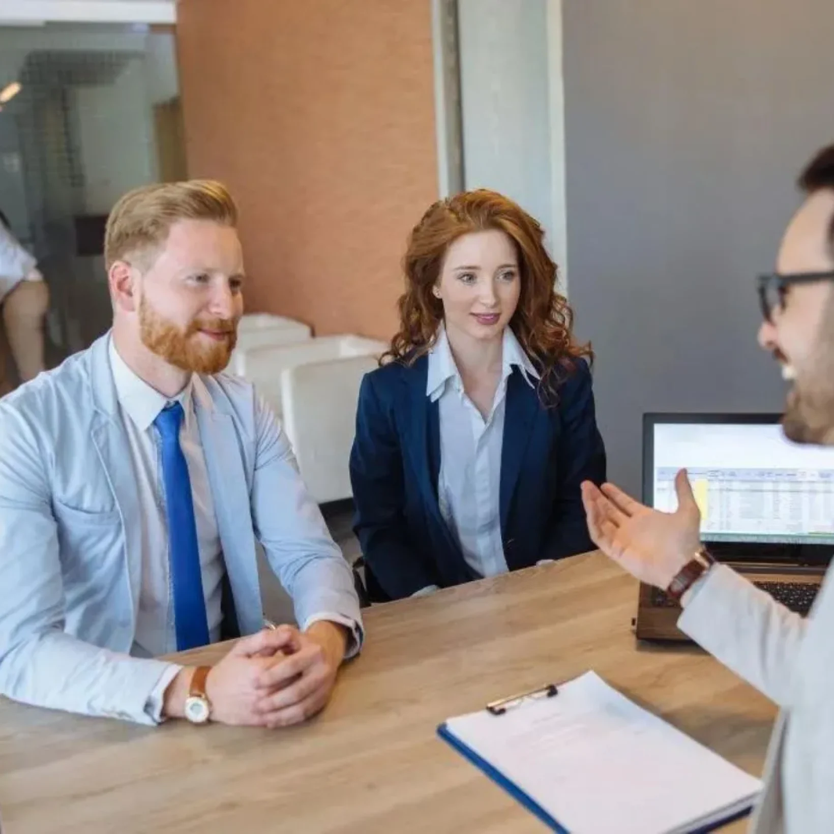 young-couple-talking-to-loan-officer