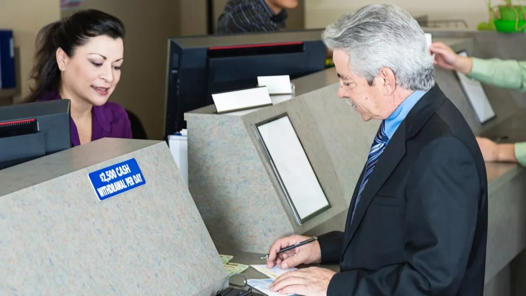 Bank Teller With Customer 1024x577