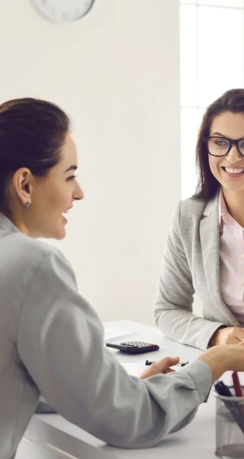 female business owner consulting a business loan broker