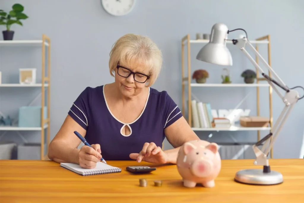 Serious Mature Lady Doing Her Accounts Planning Budget Or Analyzing Pension Plan 1024x683