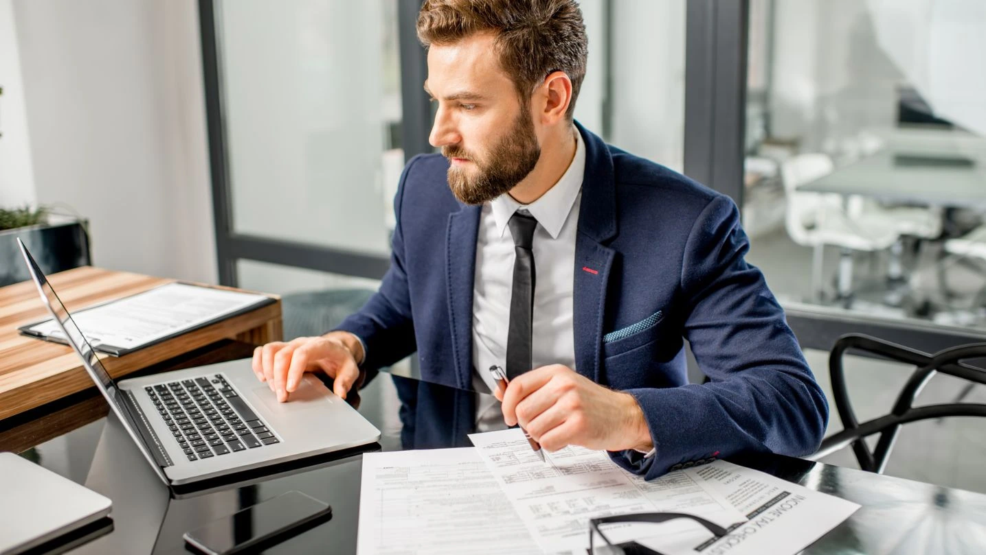 Tax Manager Working At The Office