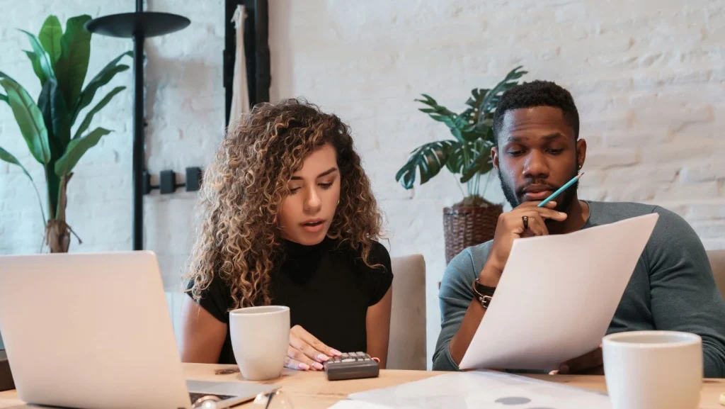 Young Couple Planning Monthly Budget Together