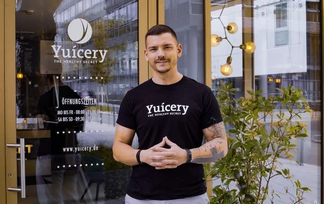 Man In Black Crew Neck T Shir Tstanding Beside Green Plant